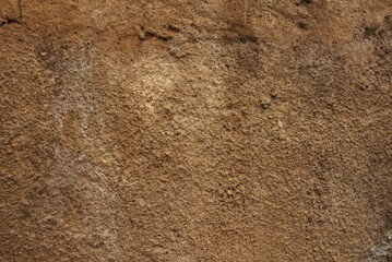 weathered brown stone plaster background texture © Sick