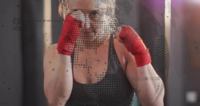 Vertical video: Female boxer adjusting hands raising guard, shadowboxing with red wraps for fitness