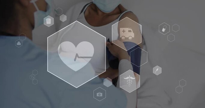 Nurse bringing BP cuff, securing patient arm, preparing to read as health hexes highlighting heart