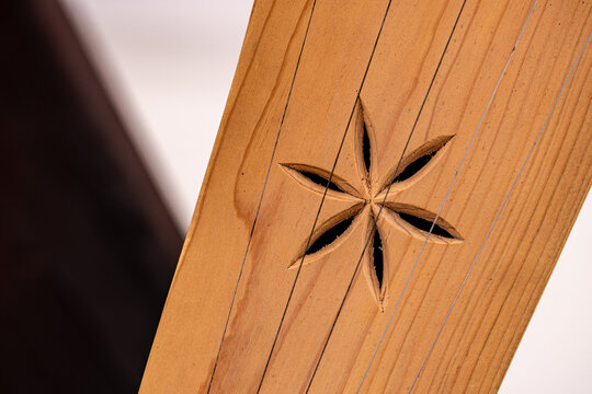 Decorative detail of Kankles, Lithuanian plucked string instrument belonging to the Baltic box zither family known as the Baltic psaltery, in Latvian kokles, Estonian kannel, Finnish kantele