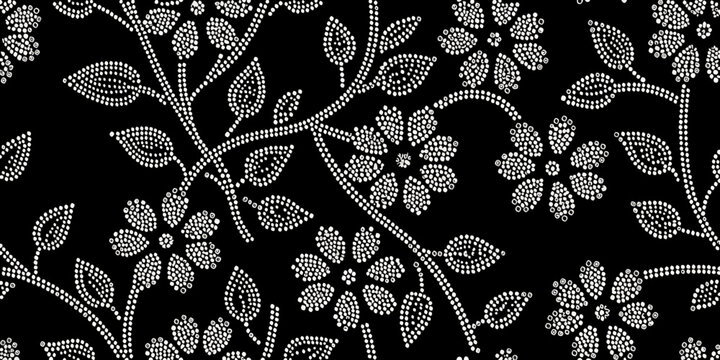 Elegant floral pattern composed of small white circular dots on black