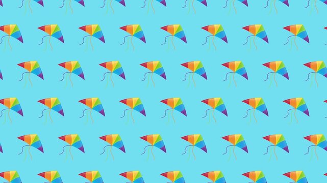 Seamless pattern of colorful rainbow kites on a blue background