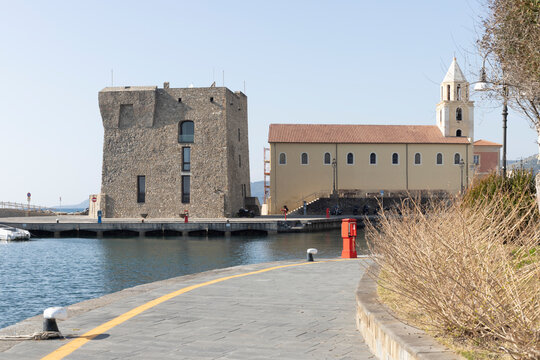 Acciaroli harbour with ancient stone tower and church