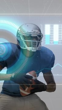 Vertical video: Football player tucking ball and turning head as HUD fading in enables sports tech