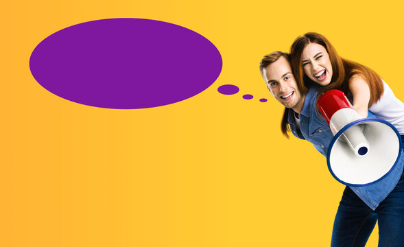 Expressive happy couple holds mega phone. Man and woman shout yell say advertise use loudspeaker megaphone. Sales ad concept. Isolated purple background. White mockup empty speech bubble speechbubble