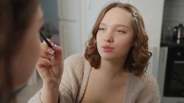 Caucasian Woman Applying Eyeshadow To Friend, Cozy Apartment Dressing Table, Soft Natural Light, Gentle Brush Strokes, Focused Expression, Makeup Brushes And Palette On Table, Quiet Bonding Moment,