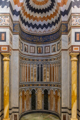 Ornate Islamic mihrab and mosque interior with marble inlay in Cairo, Egypt, traditional architecture