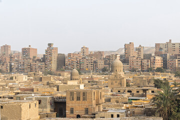 Historic Cairo cityscape with domed mausoleums and apartment blocks in Cairo, Egypt