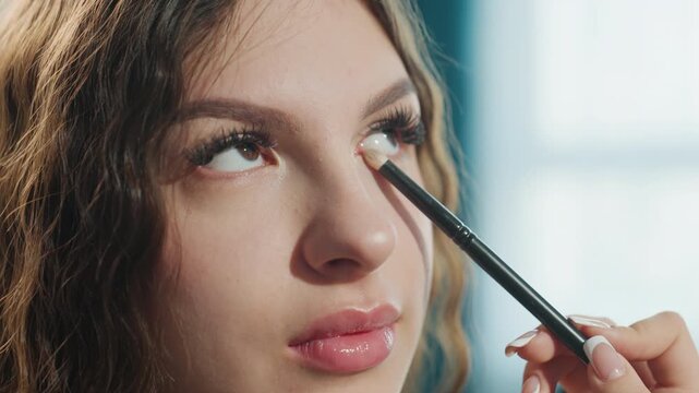 Elegant Eye Makeup Application Process, Glamorous Model Applying Eyeshadow Precisely With Brush, Detailed Shot Capturing Glamorous Model Carefully Applying And Blending Eye Makeup With Precision