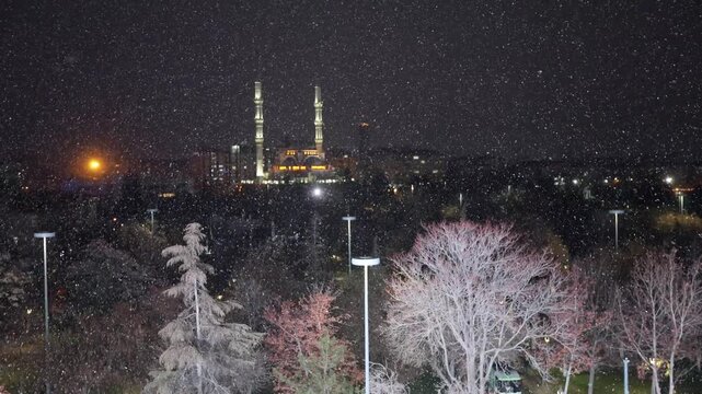 A mosque in Konya city center and snowfall.