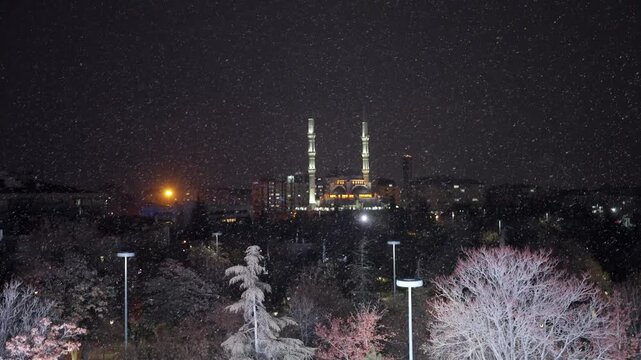 A mosque in Konya city center and snowfall.