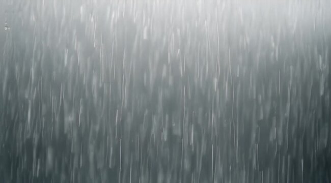 Abstract pattern of vertical streaks and dappled light on a gray surface