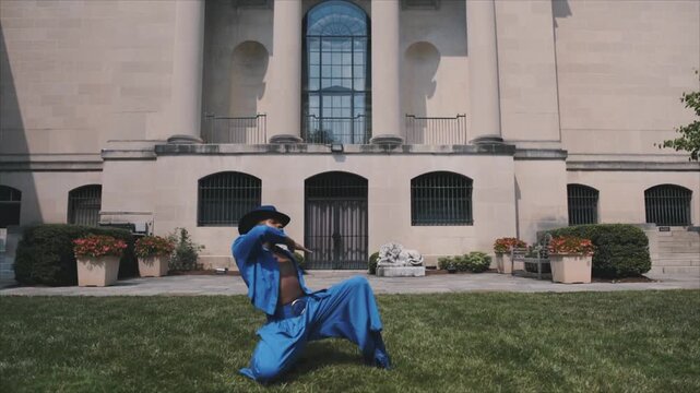Young non binary person expressing their identity through a graceful and powerful dance performance