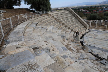 Aerial view of the archaeological ruins of Metropolis Ancient City in Turkey, showcasing historic stone structures and the remains of a classical ancient settlement.