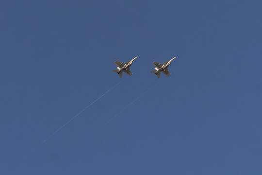 Naval Power: Underbelly Silhouette of a pair of F/A-18 Super Hornet over NAS Key West