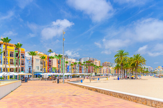 Villajoyosa old town embankment promenade with typical colorful houses buildings Les Cases de Colors, Platja Centre Central Beach, La Vila Joiosa city historical centre, Alicante province, Spain