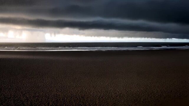 A brooding shelf cloud looms over a dark, empty beach; dim light leaks beneath the cloud deck as distant rain veils the horizon and small waves trace pale lines across the wide, wet sand.