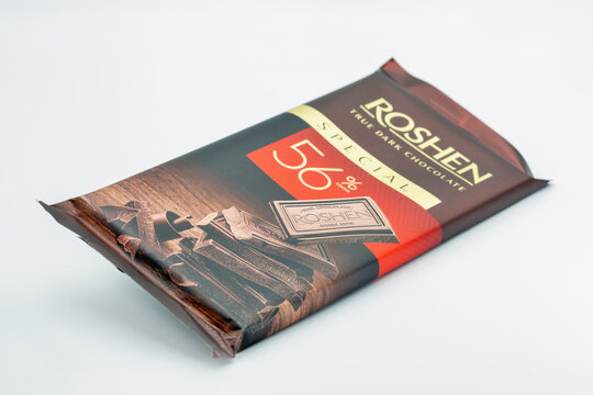 Roshen true dark chocolate cocoa premium bar closeup on white.