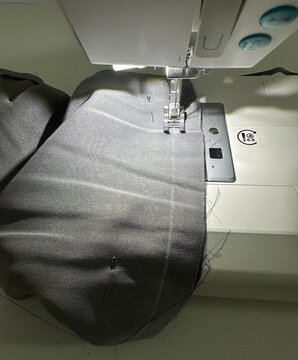 Professional Sewing Machine in Motion, Needle Sewing Cotton Fabric, Tailoring Concept