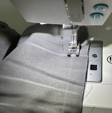 Professional Sewing Machine in Motion, Needle Sewing Cotton Fabric, Tailoring Concept