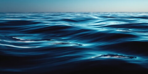 Naklejka premium Deep Blue Ocean Waves with Gentle Ripples and Reflective Surface.