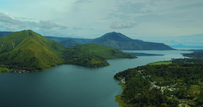 Aerial drone view of tropical mountain hills surrounding Lake Toba