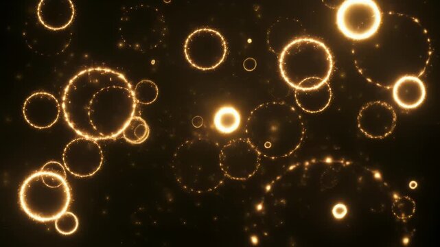 きらめく粒子が漂う暗い空間で光のリングが重なり広がる幻想的抽象背景