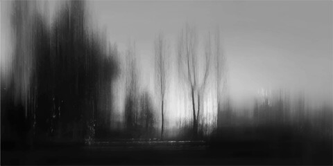 A dark and misty morning landscape where thick white fog and smoke-like clouds drift through a winter forest of black trees under a stormy sky © ITS OK