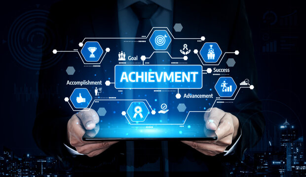 A business professional is holding a tablet that displays various digital icons symbolizing achievement, success, and goals in a modern tech setting. Tessel