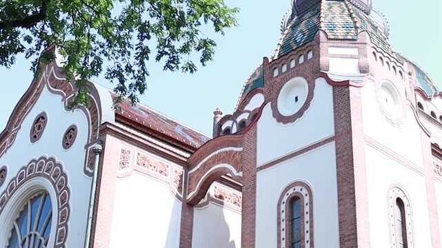 Cinematic exterior of a historic European synagogue with Moorish architecture