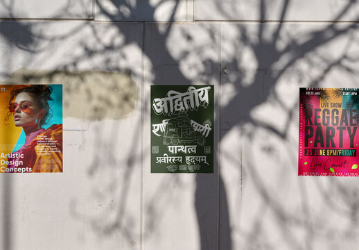 Real photo of Urban Wall With three posters. PSD template mockup.