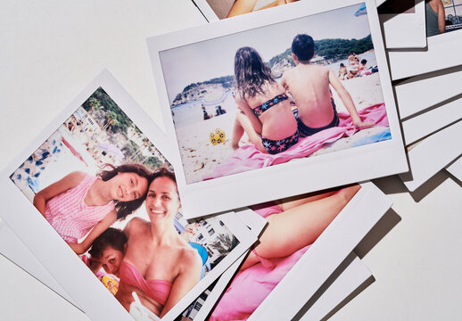 Real photo of Collection of Instant Photos on Table. PSD template mockup.