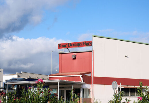 Real photo of Storefront Mockup Under Clear Sky. PSD template mockup.