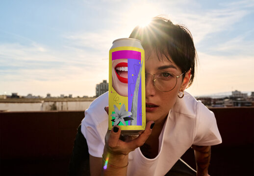 Real photo of woman Holding a Can on a Rooftop at Sunset. PSD template mockup.