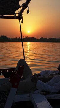 Golden Sunset Over the Nile River Seen from Felucca Sailboat