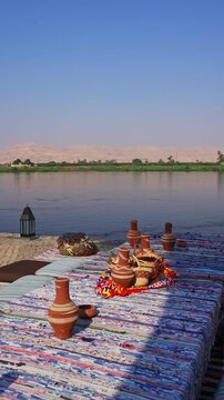 Authentic Travel Scene with Egyptian Tea and Felucca Boats on the Nile