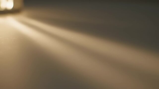 Sunlight beams through a window onto a textured surface.