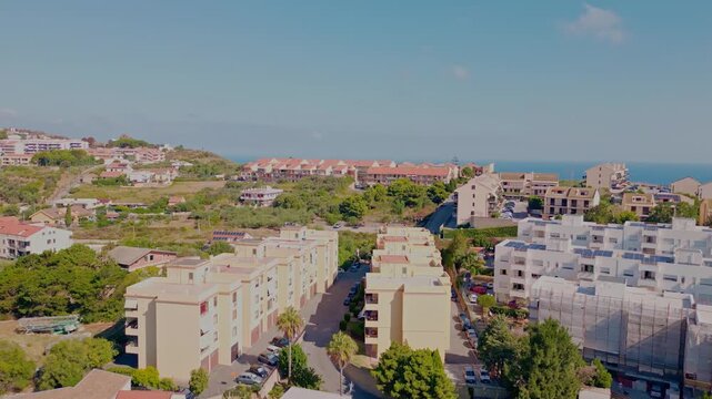 Cinematic aerial drone panorama of Ganzirri and Capo Peloro, Sicily. Stunning coastal landscape near Messina with the Lakes of Ganzirri and the narrow sea channel between Tyrrhenian and Ionian waters