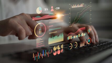 A business analyst uses innovative data visualization tools on a laptop, highlighting statistics and trends, showcasing a modern professional workspace. Impute