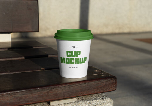 Coffee Cup Standing on a Bench Mockup