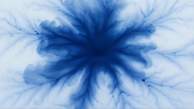 Abstract blue ink diffusion creating branching, organic patterns on a white background