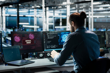 Data center computer scientist trying to fix malfunctions using AI program. Server hub IT professional using machine learning to optimize system health, repairing critical error