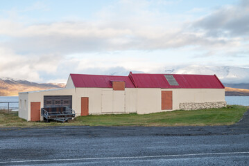 old farm buildings in the village of Hauganes in Iceland