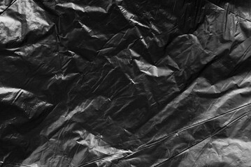 Crumpled black plastic warp texture background variant 2 © Sick