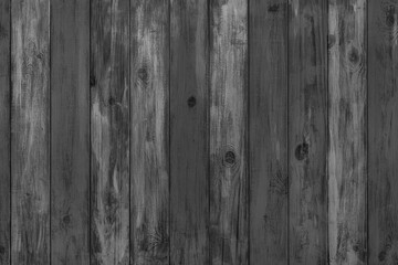 Fototapeta premium Black colored painted wooden board with visible grain and vertical planks, wall wooden surface. Rustic wood texture background, design element, wallpaper, backdrop