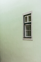 facade of residential building with wooden window