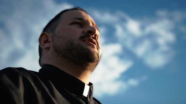 Spiritual Priest Looking At God In The Sky 