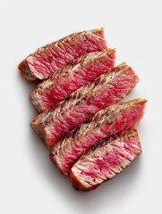 medium-cooked steak slices, perfectly sliced beef with a warm pink center and seared brown edges