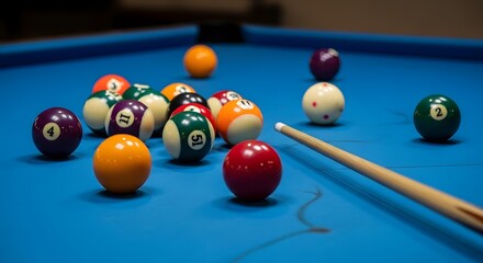 Billiard Balls and Cue on Blue Pool Table Surface