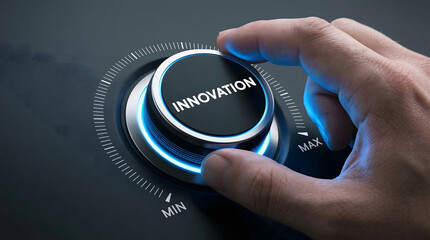 Hand turning innovation dial to max setting for business success